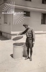 Soldier Checking Trash Can